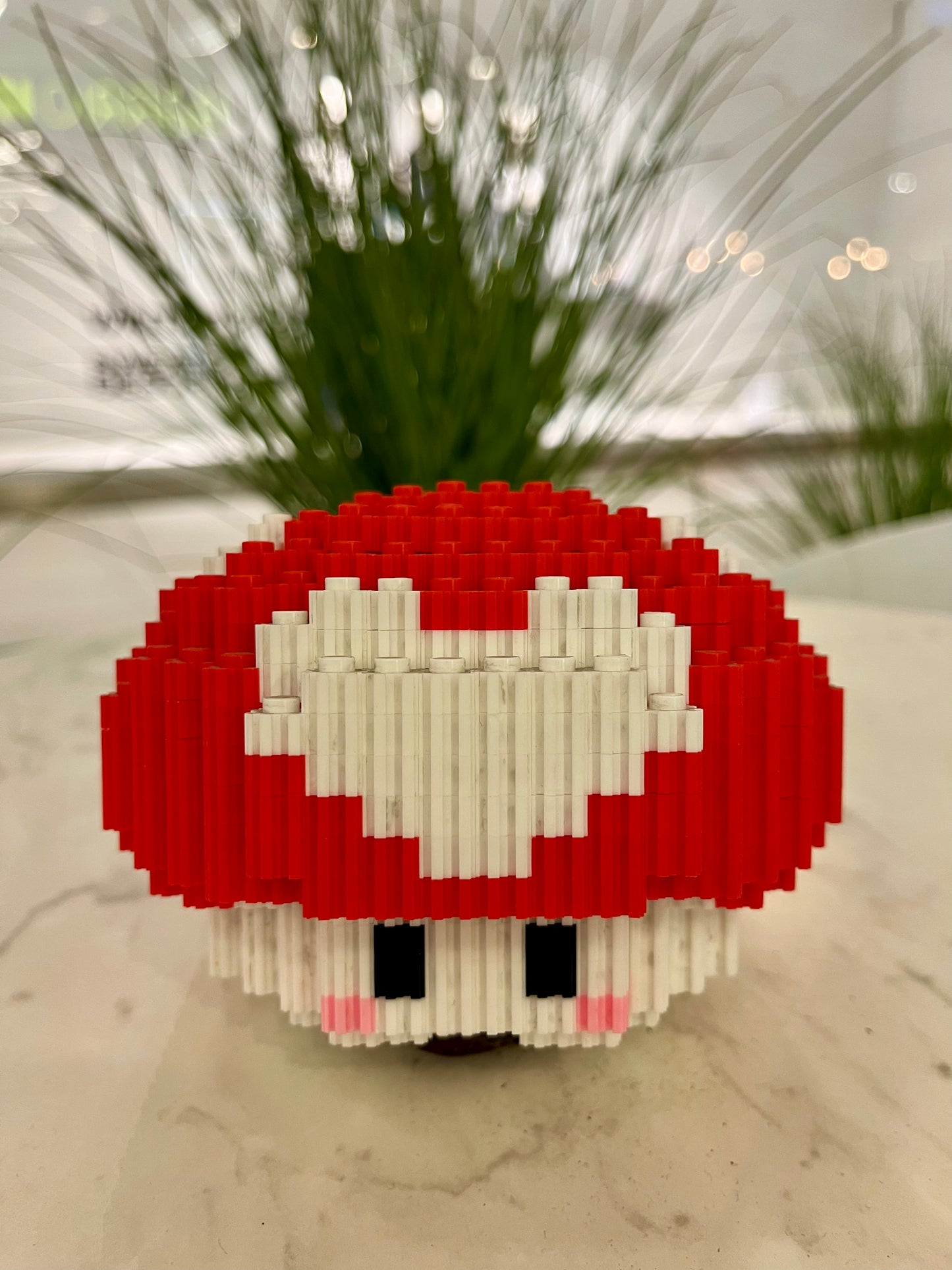 Figura pixel armable del hongo rojo de Super Mario Bros